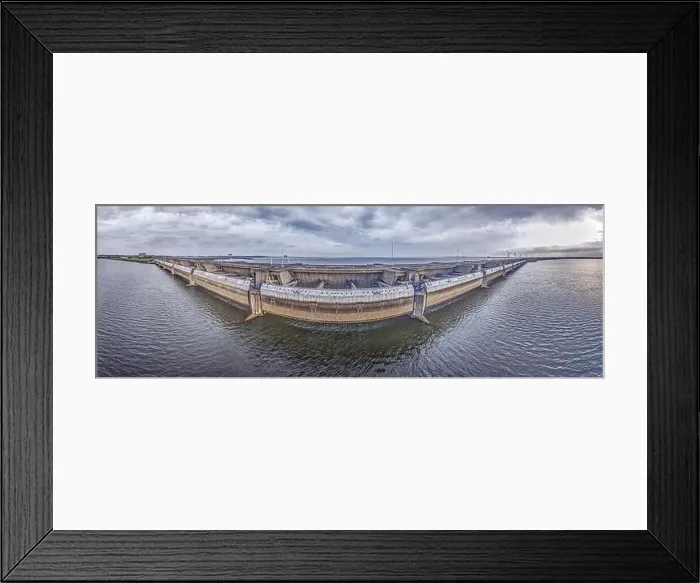 Framed Print : Drone image over the Haringvlietdam flood barrier near the Dutch town of Ouddorp against a cloudy morning sky Framed Print : Drone image over the Haringvlietdam flood barrier near the Dutch town of Ouddorp against a cloudy morning sky