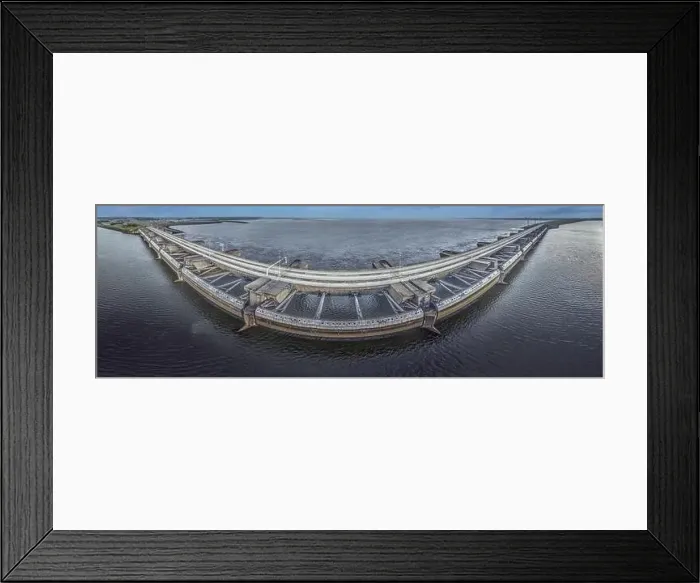 Framed Print : Drone image over the Haringvlietdam flood barrier near the Dutch town of Ouddorp against a cloudy morning sky Framed Print : Drone image over the Haringvlietdam flood barrier near the Dutch town of Ouddorp against a cloudy morning sky