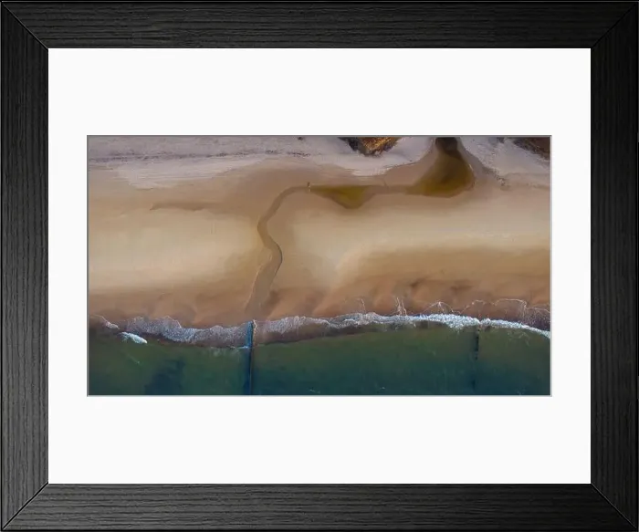 Framed Print : Beach from above: Sun-kissed sands, calm ocean
