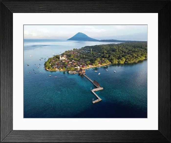 Framed Print : Indonesia Bunaken - Drone view Bunaken Island with coral reef and jetty and Manadotua Island