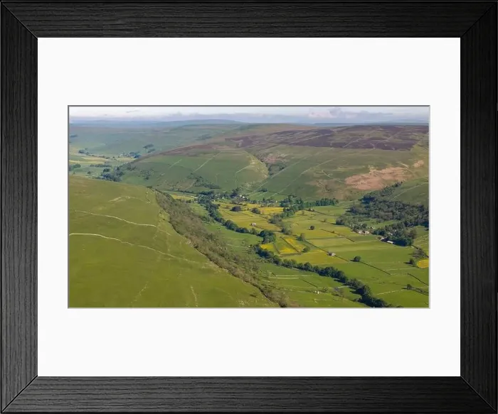 Framed Print : Aerial view of a quaint Yorkshire Dales village nestled among vibrant buttercup meadows Framed Print : Aerial view of a quaint Yorkshire Dales village nestled among vibrant buttercup meadows