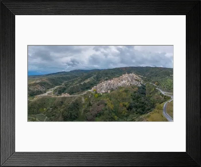 Framed Print : Drone perspective of the picturesque mountain village and church of Badolato in Calabria Framed Print : Drone perspective of the picturesque mountain village and church of Badolato in Calabria