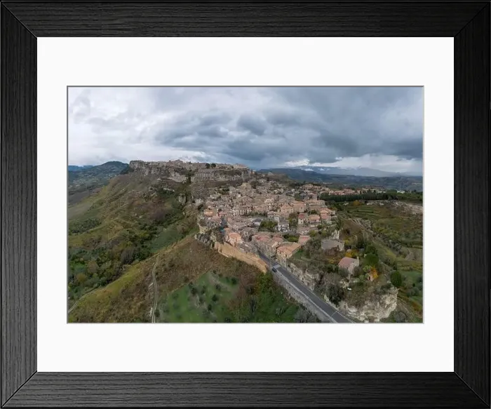 Framed Print : Drone perspective of the picturesque mountain village of Gerace in Calabria Framed Print : Drone perspective of the picturesque mountain village of Gerace in Calabria