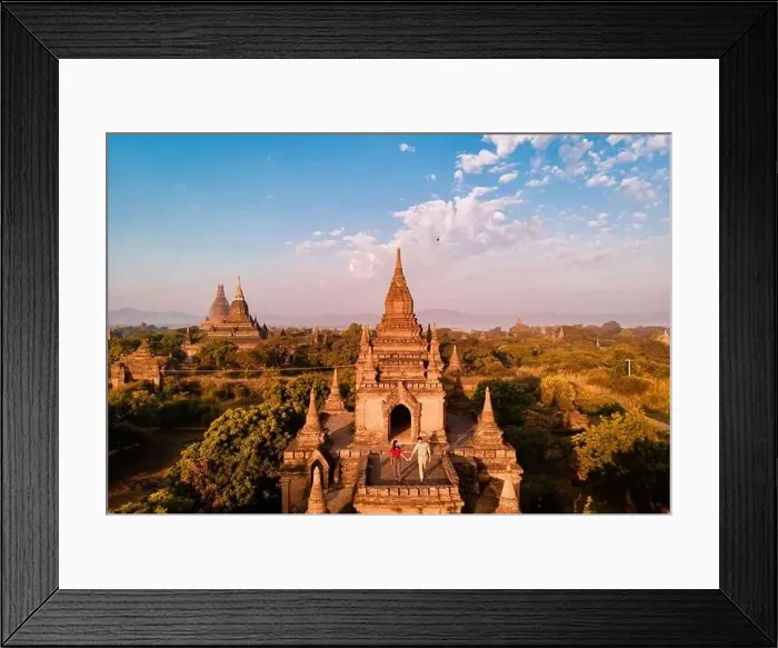 Framed Print : A temple surrounded by trees under a blue sky with fluffy clouds Framed Print : A temple surrounded by trees under a blue sky with fluffy clouds