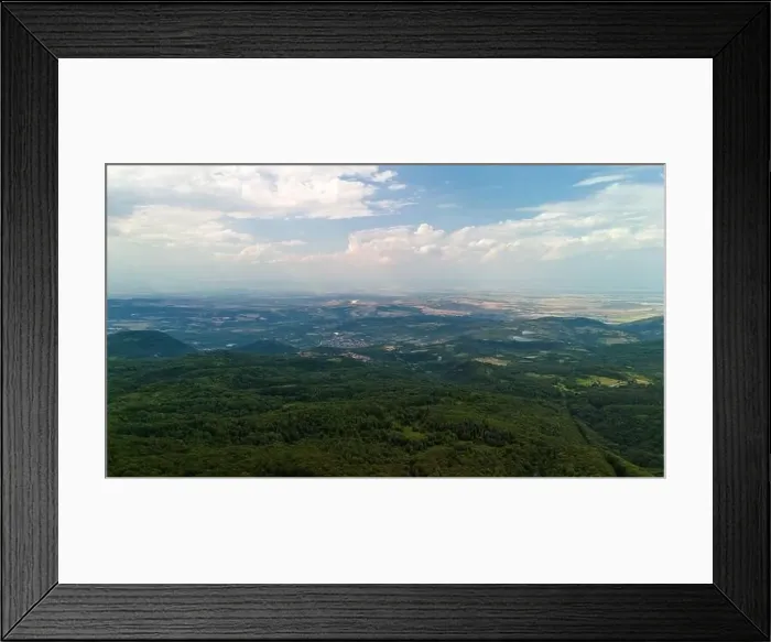 Framed Print : Aerial view of beautiful green forest covering the mountain range Framed Print : Aerial view of beautiful green forest covering the mountain range