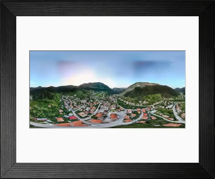 Framed Print : Drone capturing a panoramic view of a small village nestled in a valley Framed Print : Drone capturing a panoramic view of a small village nestled in a valley
