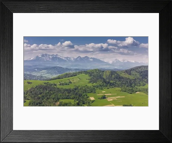 Framed Print : Aerial drone view over green hills of Pieniny National Park and snowy Tatra Mountains Framed Print : Aerial drone view over green hills of Pieniny National Park and snowy Tatra Mountains