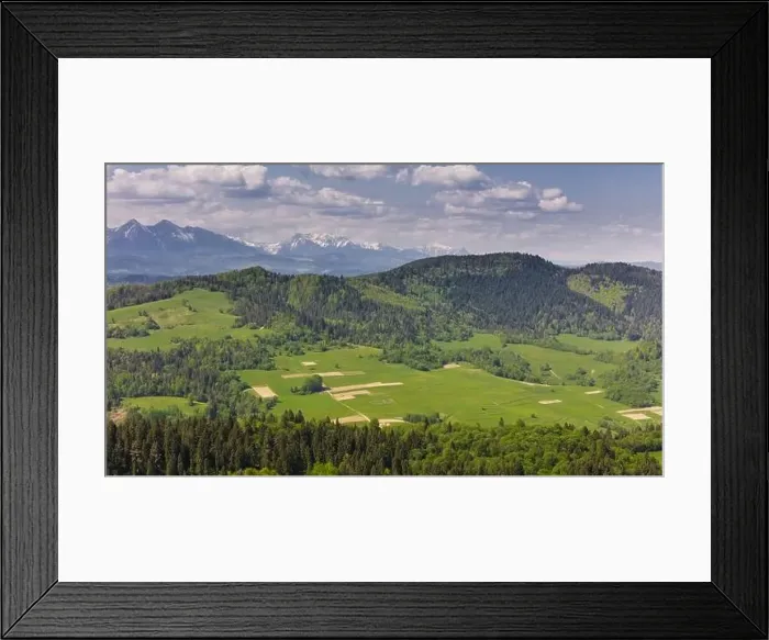 Framed Print : Aerial drone view over green hills of Pieniny National Park and snowy Tatra Mountains Framed Print : Aerial drone view over green hills of Pieniny National Park and snowy Tatra Mountains