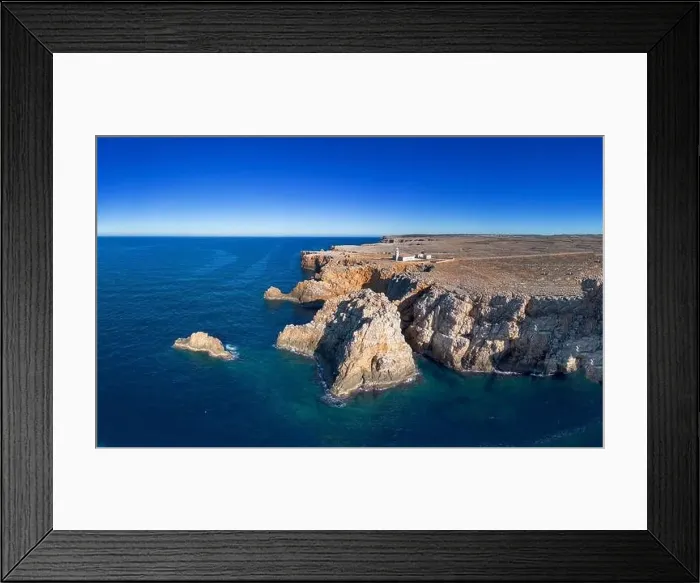Framed Print : View of the Punta Nati lighthouse and coastal cliffs in northwestern Menorca Framed Print : View of the Punta Nati lighthouse and coastal cliffs in northwestern Menorca