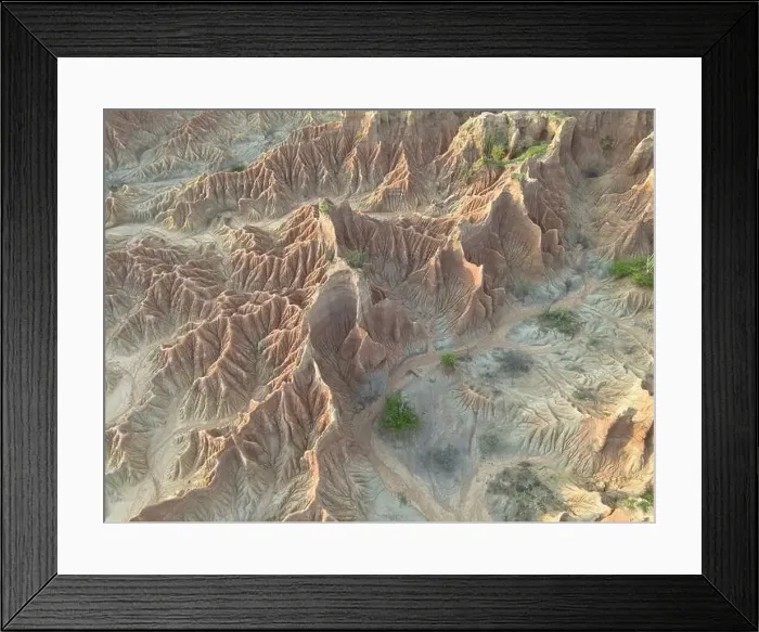 Framed Print : This aerial perspective captures the rugged terrain of the Tatacoa Desert Framed Print : This aerial perspective captures the rugged terrain of the Tatacoa Desert
