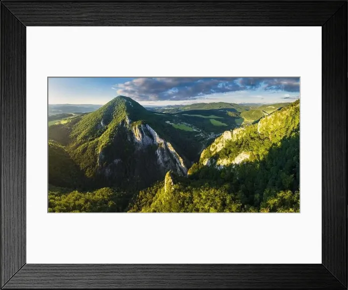 Framed Print : Aerial view of beautiful green hills at sunset. Colorful landscape with rural road, trees, grass and buildings. Slovakia Framed Print : Aerial view of beautiful green hills at sunset. Colorful landscape with rural road, trees, grass and buildings. Slovakia