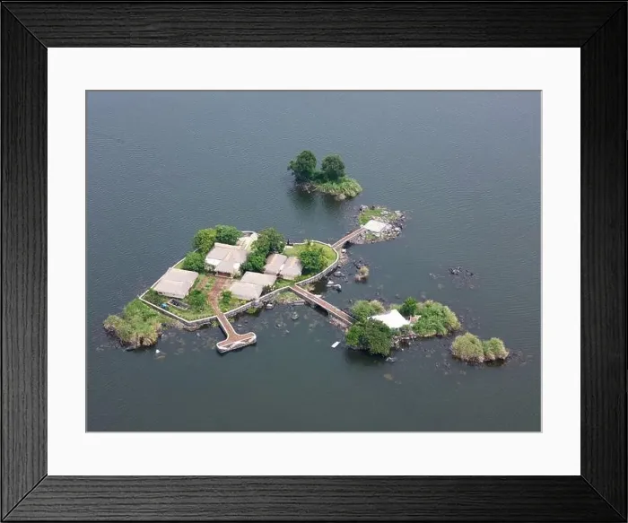 Framed Print : Private island with helicopter pad aerial drone view Framed Print : Private island with helicopter pad aerial drone view