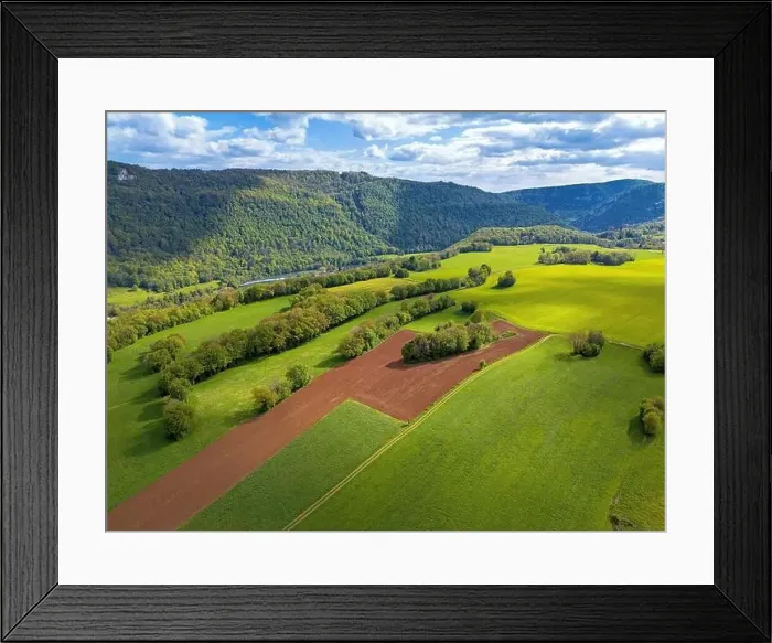 Framed Print : Landscape with fields, mountains and river in France near Besancon in spring, Franche-Comte Framed Print : Landscape with fields, mountains and river in France near Besancon in spring, Franche-Comte