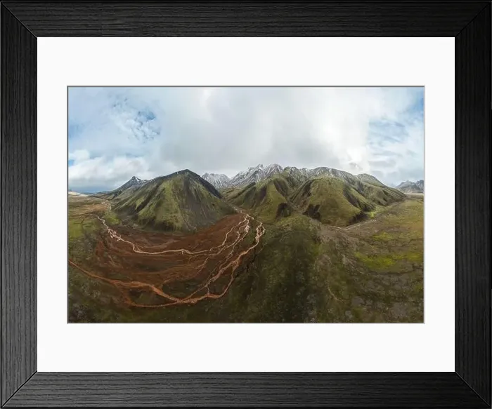 Framed Print : A stunning panoramic shot showcasing the verdant highlands of Iceland, with undulating mountains and a meandering trail Framed Print : A stunning panoramic shot showcasing the verdant highlands of Iceland, with undulating mountains and a meandering trail