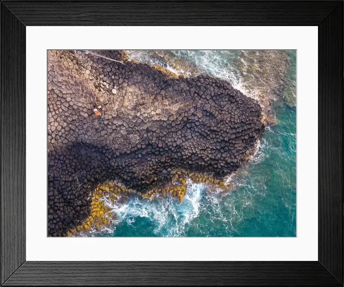 Framed Print : View of Ganh Da Dia or Da Dia Reef is a seashore area of uniformly interlocking basalt rock columns located along Framed Print : View of Ganh Da Dia or Da Dia Reef is a seashore area of uniformly interlocking basalt rock columns located along