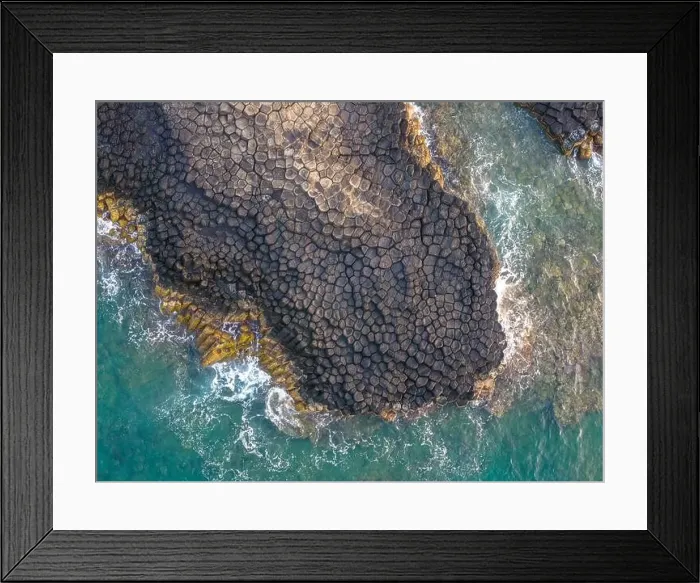 Framed Print : View of Ganh Da Dia or Da Dia Reef is a seashore area of uniformly interlocking basalt rock columns located along Framed Print : View of Ganh Da Dia or Da Dia Reef is a seashore area of uniformly interlocking basalt rock columns located along