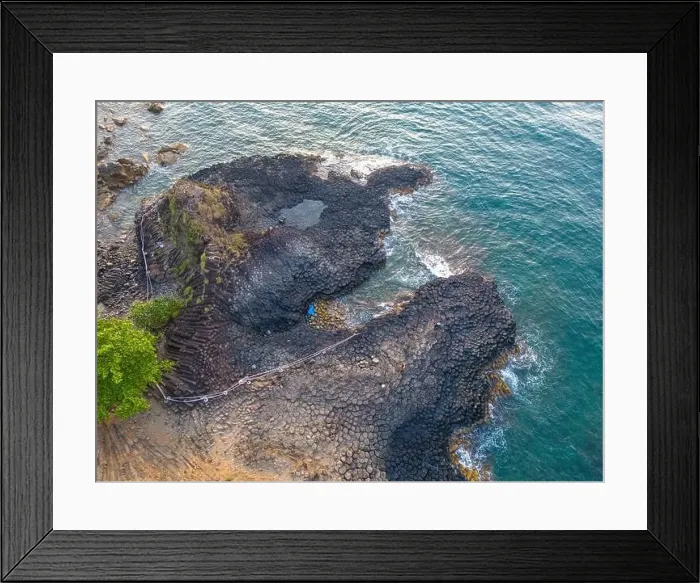 Framed Print : View of Ganh Da Dia or Da Dia Reef is a seashore area of uniformly interlocking basalt rock columns located along Framed Print : View of Ganh Da Dia or Da Dia Reef is a seashore area of uniformly interlocking basalt rock columns located along