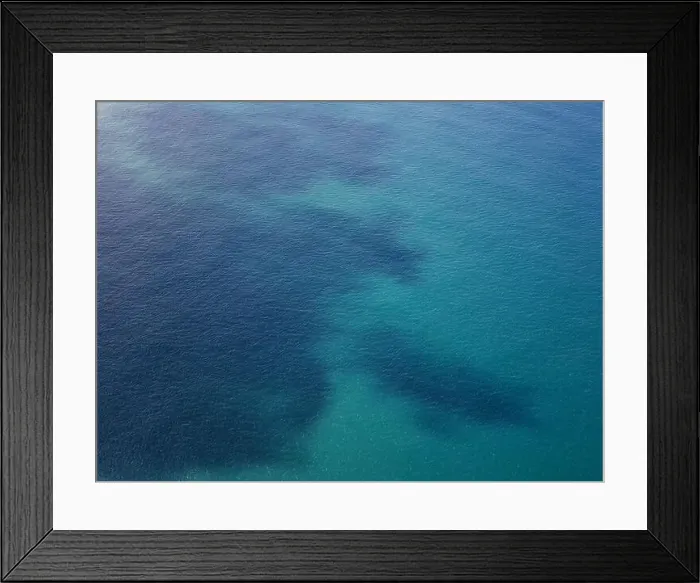 Framed Print : Blue ocean water with dark spot aerial drone view Framed Print : Blue ocean water with dark spot aerial drone view