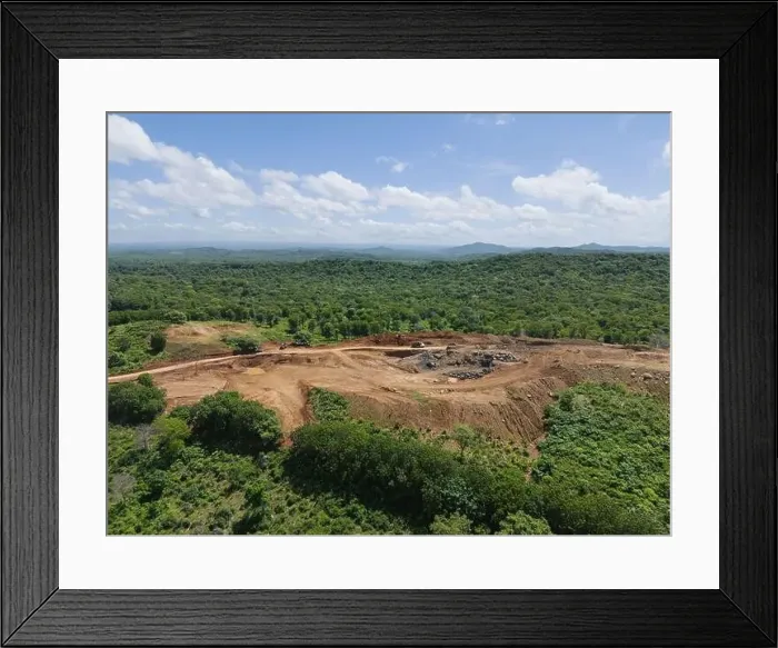 Framed Print : Wide mine quarry on green natural landscape aerial drone view on sunny day Framed Print : Wide mine quarry on green natural landscape aerial drone view on sunny day
