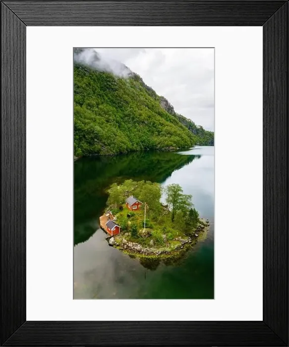 Framed Print : A small island with two red cabins nestled amongst lush greenery sits peacefully in a Norwegian fjord Framed Print : A small island with two red cabins nestled amongst lush greenery sits peacefully in a Norwegian fjord