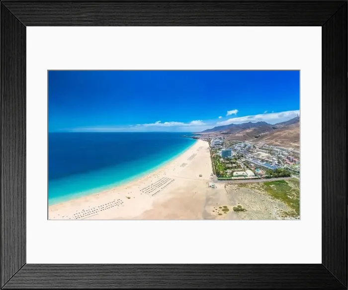 Framed Print : White sandy beach and blue water in Morro Jable, south of Fuerteventura, Canary islands, Spain Framed Print : White sandy beach and blue water in Morro Jable, south of Fuerteventura, Canary islands, Spain