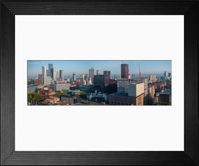 Framed Print : Aerial view of Manchester cityscape with skyscrapers and construction sites Framed Print : Aerial view of Manchester cityscape with skyscrapers and construction sites