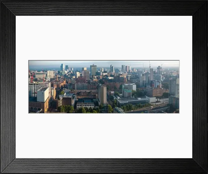 Framed Print : Aerial view of Manchester cityscape with skyscrapers and construction sites Framed Print : Aerial view of Manchester cityscape with skyscrapers and construction sites