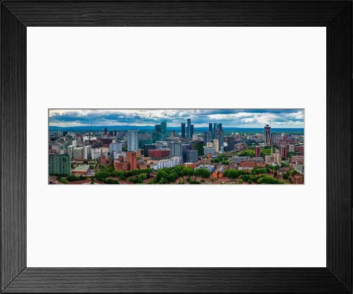 Framed Print : Aerial view of Manchester cityscape with skyscrapers and construction sites Framed Print : Aerial view of Manchester cityscape with skyscrapers and construction sites