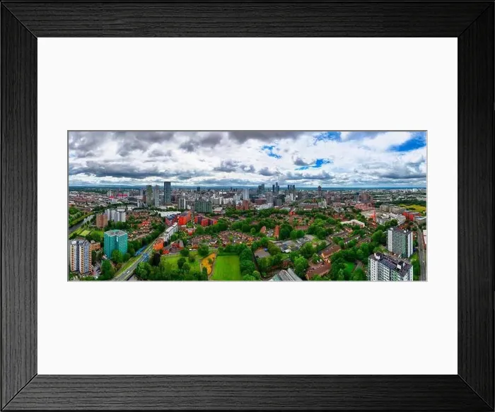 Framed Print : Aerial view of Manchester cityscape with skyscrapers and construction sites Framed Print : Aerial view of Manchester cityscape with skyscrapers and construction sites