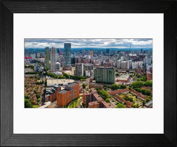 Framed Print : Aerial view of Manchester cityscape with skyscrapers and construction sites Framed Print : Aerial view of Manchester cityscape with skyscrapers and construction sites