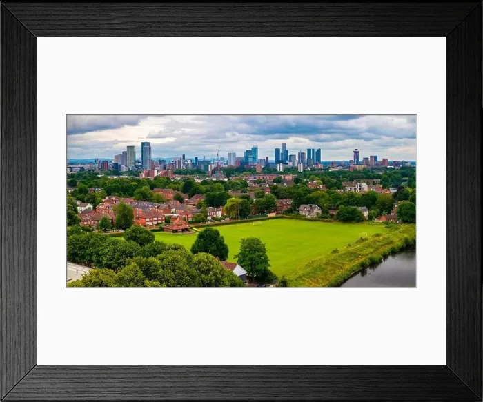 Framed Print : Aerial view of Manchester cityscape with skyscrapers and construction sites Framed Print : Aerial view of Manchester cityscape with skyscrapers and construction sites