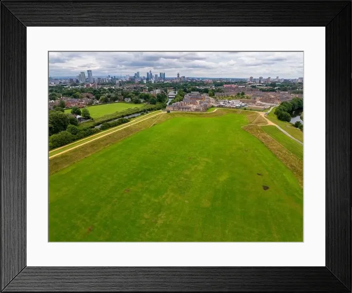 Framed Print : Aerial view of Manchester cityscape with skyscrapers and construction sites Framed Print : Aerial view of Manchester cityscape with skyscrapers and construction sites