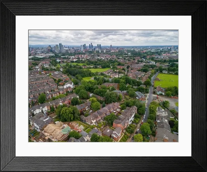 Framed Print : Aerial view of Manchester cityscape with skyscrapers and construction sites Framed Print : Aerial view of Manchester cityscape with skyscrapers and construction sites