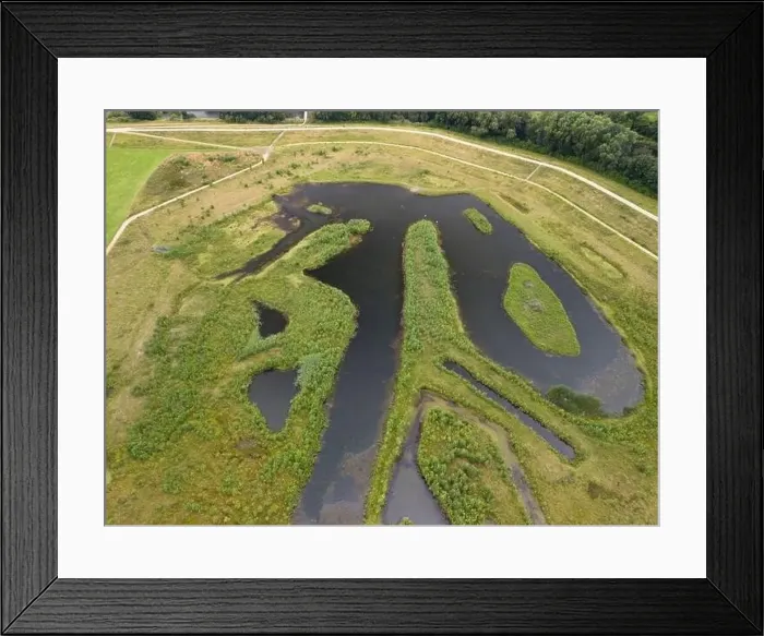 Framed Print : Aerial view of a newly created Kersal wetland park with Manchester city skyline in the background Framed Print : Aerial view of a newly created Kersal wetland park with Manchester city skyline in the background