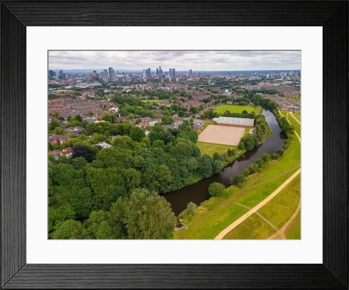 Framed Print : Aerial view of a park in Salford with a river Irwell, buildings, and a city of Manchester skyline in the background Framed Print : Aerial view of a park in Salford with a river Irwell, buildings, and a city of Manchester skyline in the background