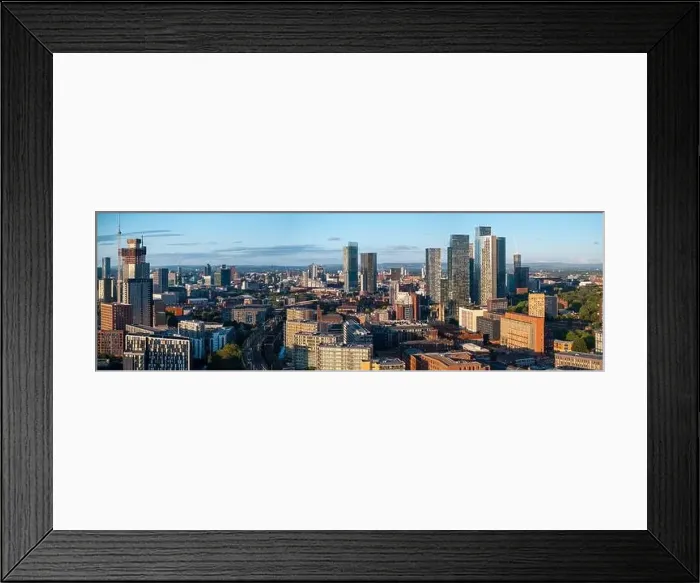 Framed Print : Aerial view of Manchester cityscape with skyscrapers and construction sites Framed Print : Aerial view of Manchester cityscape with skyscrapers and construction sites