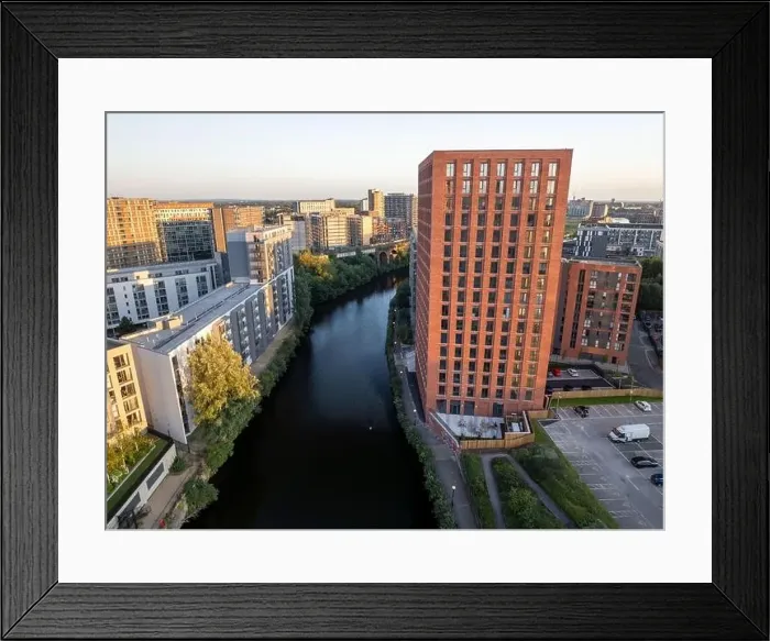 Framed Print : Aerial view of modern apartment buildings with the river Irwell and city skyline in the background Framed Print : Aerial view of modern apartment buildings with the river Irwell and city skyline in the background