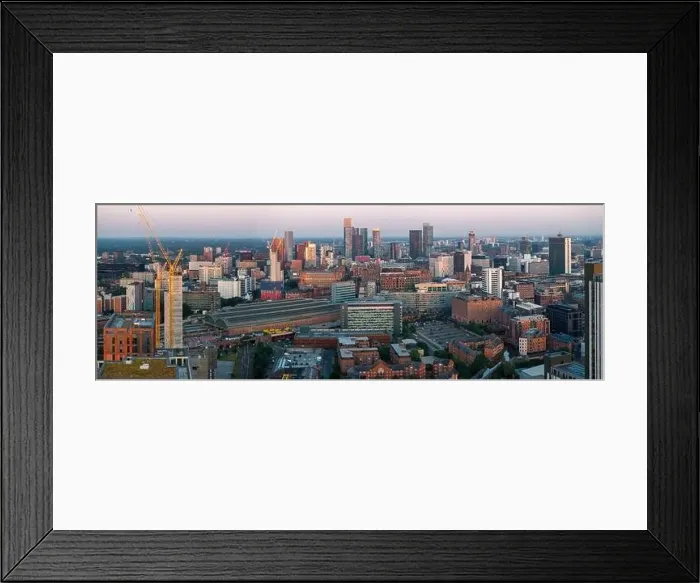 Framed Print : Aerial view of Manchester cityscape with skyscrapers and construction sites Framed Print : Aerial view of Manchester cityscape with skyscrapers and construction sites