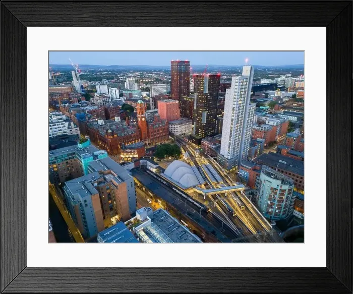 Framed Print : Aerial view of Manchester cityscape with skyscrapers and construction sites Framed Print : Aerial view of Manchester cityscape with skyscrapers and construction sites