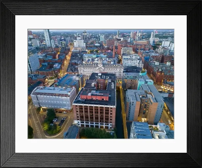 Framed Print : Aerial view of Manchester cityscape with skyscrapers and construction sites Framed Print : Aerial view of Manchester cityscape with skyscrapers and construction sites