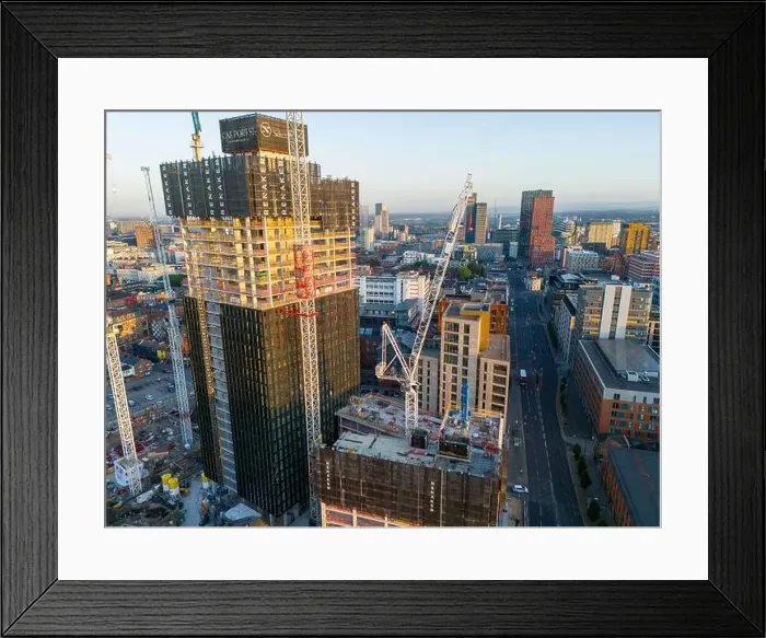 Framed Print : Aerial view of a skyscraper under construction on Ancoats area, Manchester UK Framed Print : Aerial view of a skyscraper under construction on Ancoats area, Manchester UK