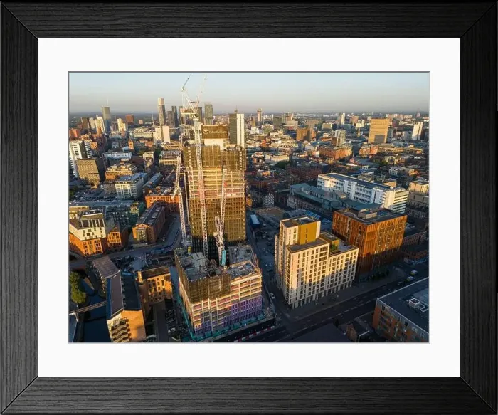 Framed Print : Aerial view of a skyscraper under construction on Ancoats area, Manchester UK Framed Print : Aerial view of a skyscraper under construction on Ancoats area, Manchester UK