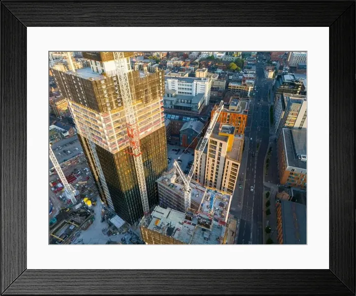 Framed Print : Aerial view of a skyscraper under construction on Ancoats area, Manchester UK Framed Print : Aerial view of a skyscraper under construction on Ancoats area, Manchester UK