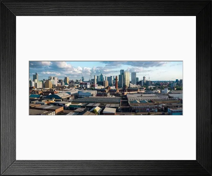 Framed Print : Aerial view of Manchester cityscape with skyscrapers and construction sites Framed Print : Aerial view of Manchester cityscape with skyscrapers and construction sites