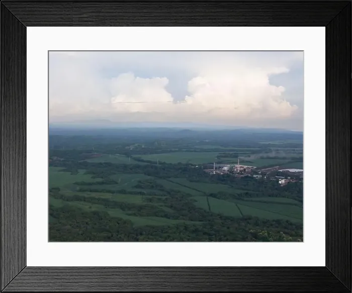 Framed Print : Big factory with tall smokey chimney on green landscape aerial drone view