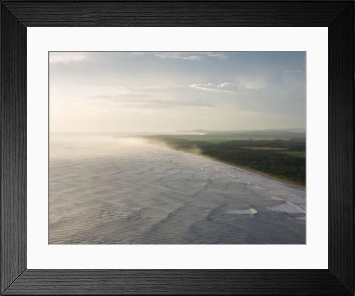 Framed Print : Tropical ocean beach coast on golden light aerial drone view
