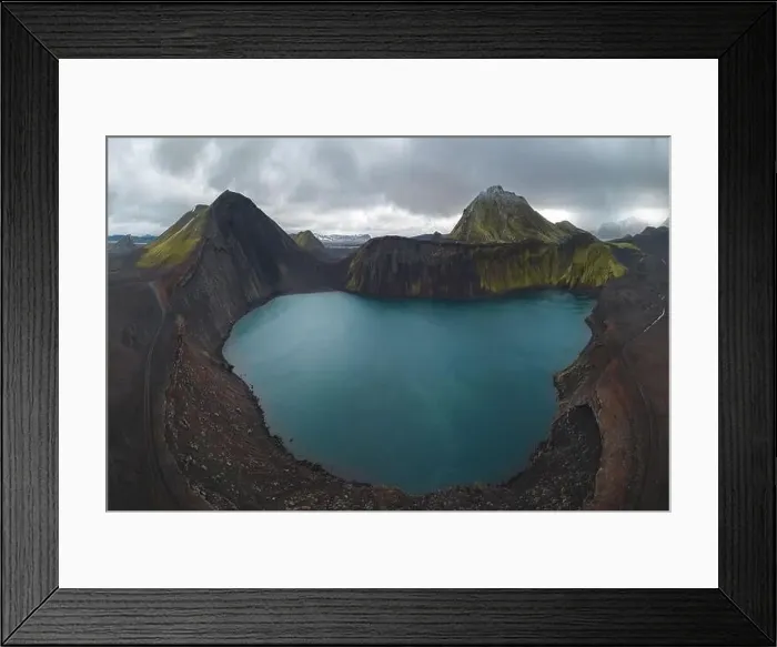 Framed Print : Drone capture of a striking turquoise lake nestled within multiple volcanic mounts in the Icelandic highlands Framed Print : Drone capture of a striking turquoise lake nestled within multiple volcanic mounts in the Icelandic highlands