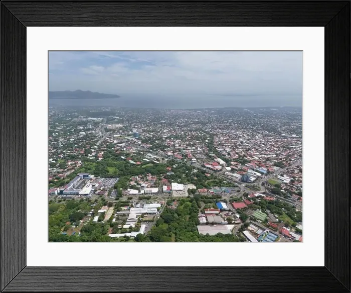 Framed Print : Managua, Nicaragua - August 16, 2024: Managua town landscape on lake background aerial drone view Framed Print : Managua, Nicaragua - August 16, 2024: Managua town landscape on lake background aerial drone view