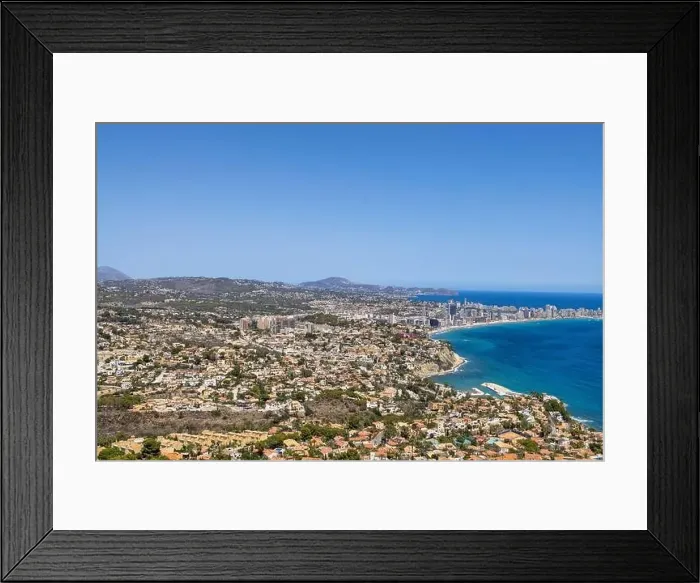 Framed Print : Aerial drone photo of the beautiful coastal town of Calp on Spain's Mediterranean coast showing an aerial drone view of Framed Print : Aerial drone photo of the beautiful coastal town of Calp on Spain's Mediterranean coast showing an aerial drone view of