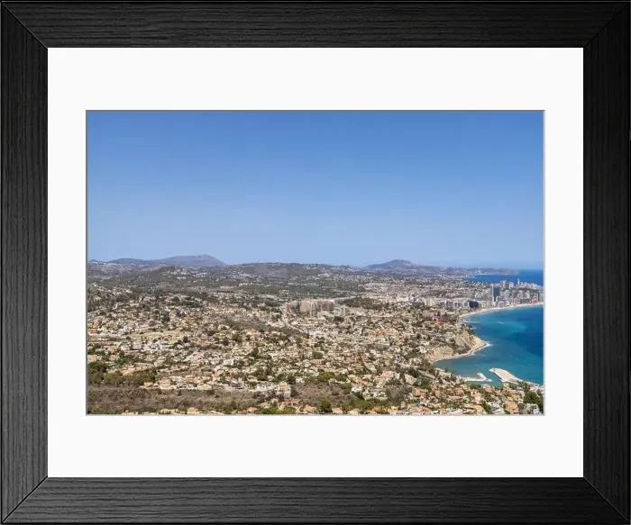 Framed Print : Aerial drone photo of the beautiful coastal town of Calp on Spain's Mediterranean coast showing an aerial drone view of Framed Print : Aerial drone photo of the beautiful coastal town of Calp on Spain's Mediterranean coast showing an aerial drone view of